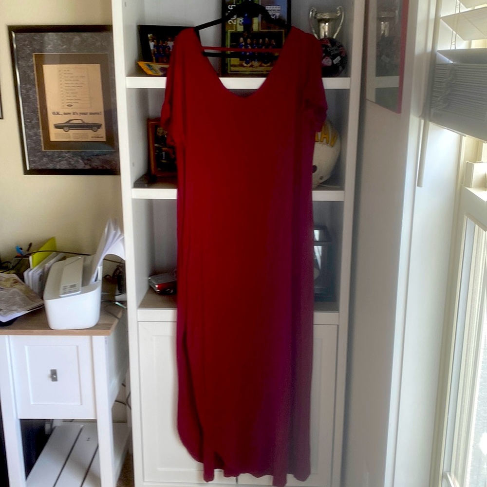 This dress has slits on both sides and pockets